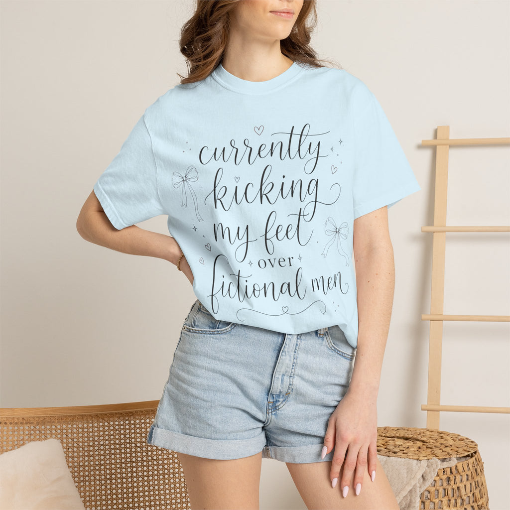 Graphic T-Shirt — “Currently Kicking My Feet Over Fictional Men” Printed Tee for Book Lovers