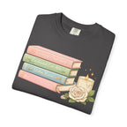 Cozy Bookstack Tee — Pastel Books, Candle & Rose Graphic T‑Shirt