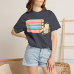 Cozy Bookstack Tee — Pastel Books, Candle & Rose Graphic T‑Shirt