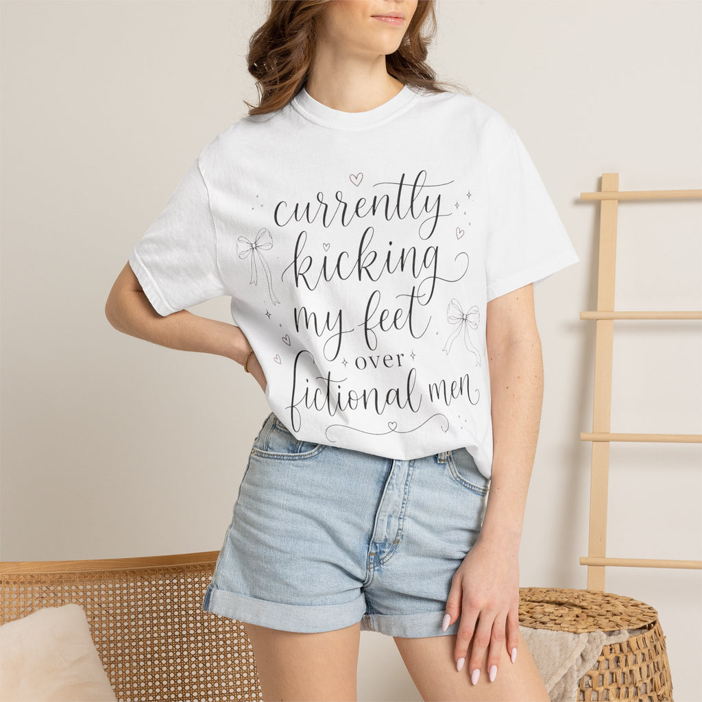 Graphic T-Shirt — “Currently Kicking My Feet Over Fictional Men” Printed Tee for Book Lovers