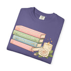 Cozy Bookstack Tee — Pastel Books, Candle & Rose Graphic T‑Shirt