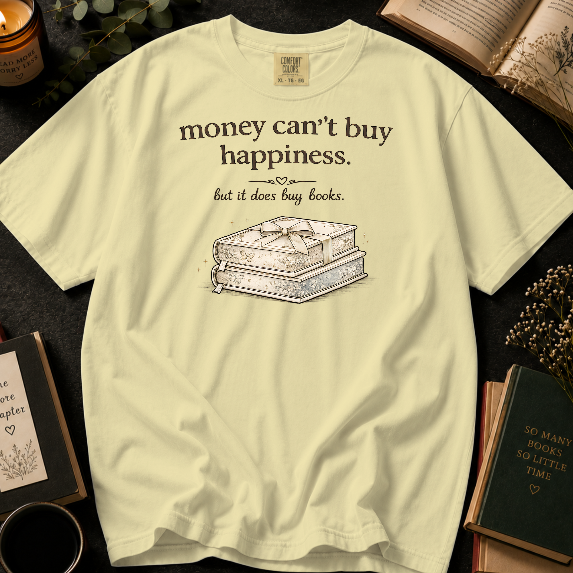 Money Can't Buy Happiness But It Does Buy Books T-Shirt: Gift Wrapped Stack in Banana - Comfort Colors® T-Shirt