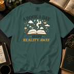 A Book A Day Keeps Reality Away T-Shirt: Whimsical Open Book in Blue Spruce - Comfort Colors® T-Shirt