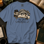 The Plot Thickens T-Shirt: Grumpy Raccoon Reading in Blue Jean - Comfort Colors® T-Shirt