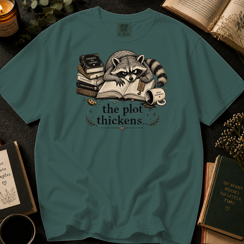 The Plot Thickens T-Shirt: Grumpy Raccoon Reading in Blue Spruce - Comfort Colors® T-Shirt