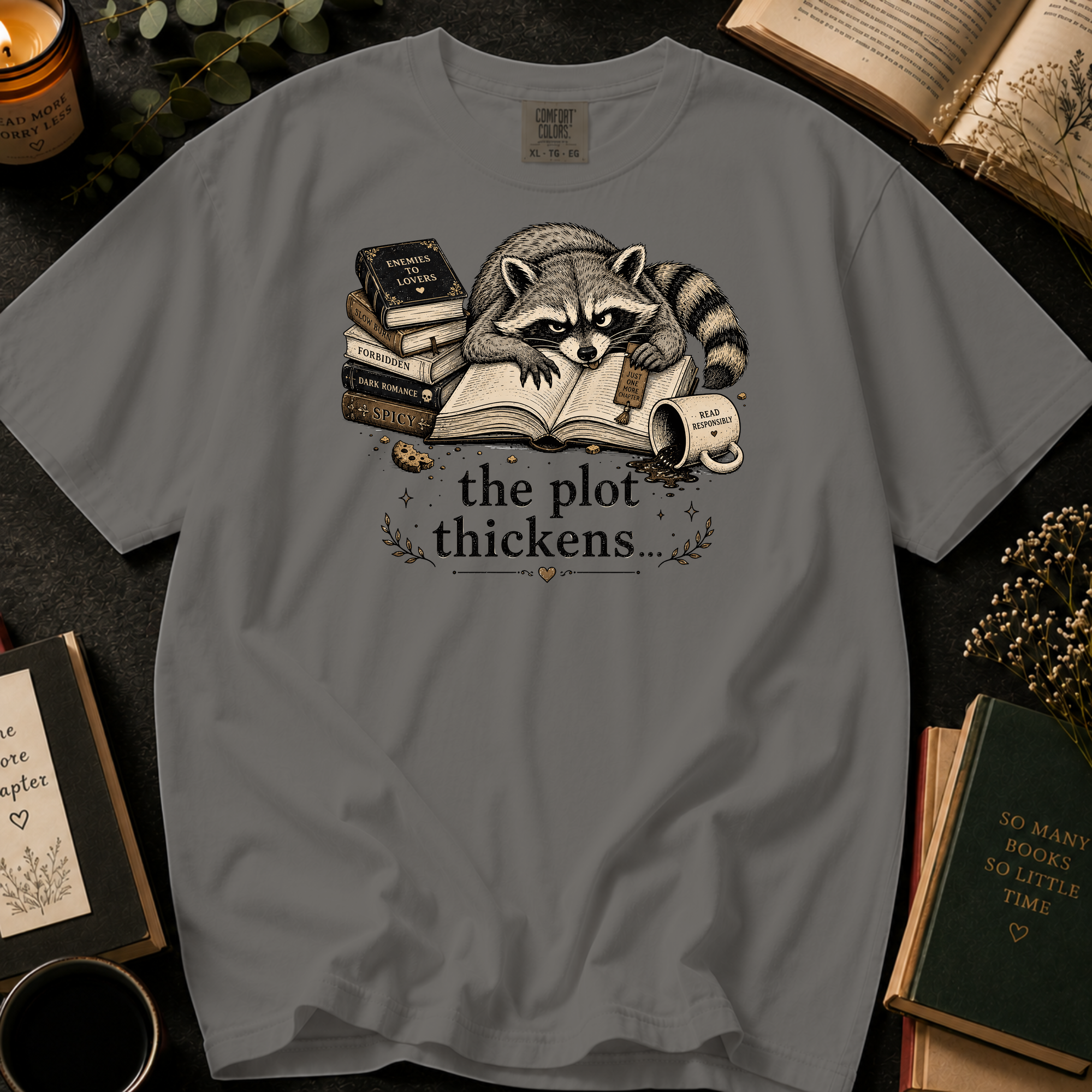 The Plot Thickens T-Shirt: Grumpy Raccoon Reading in Grey - Comfort Colors® T-Shirt