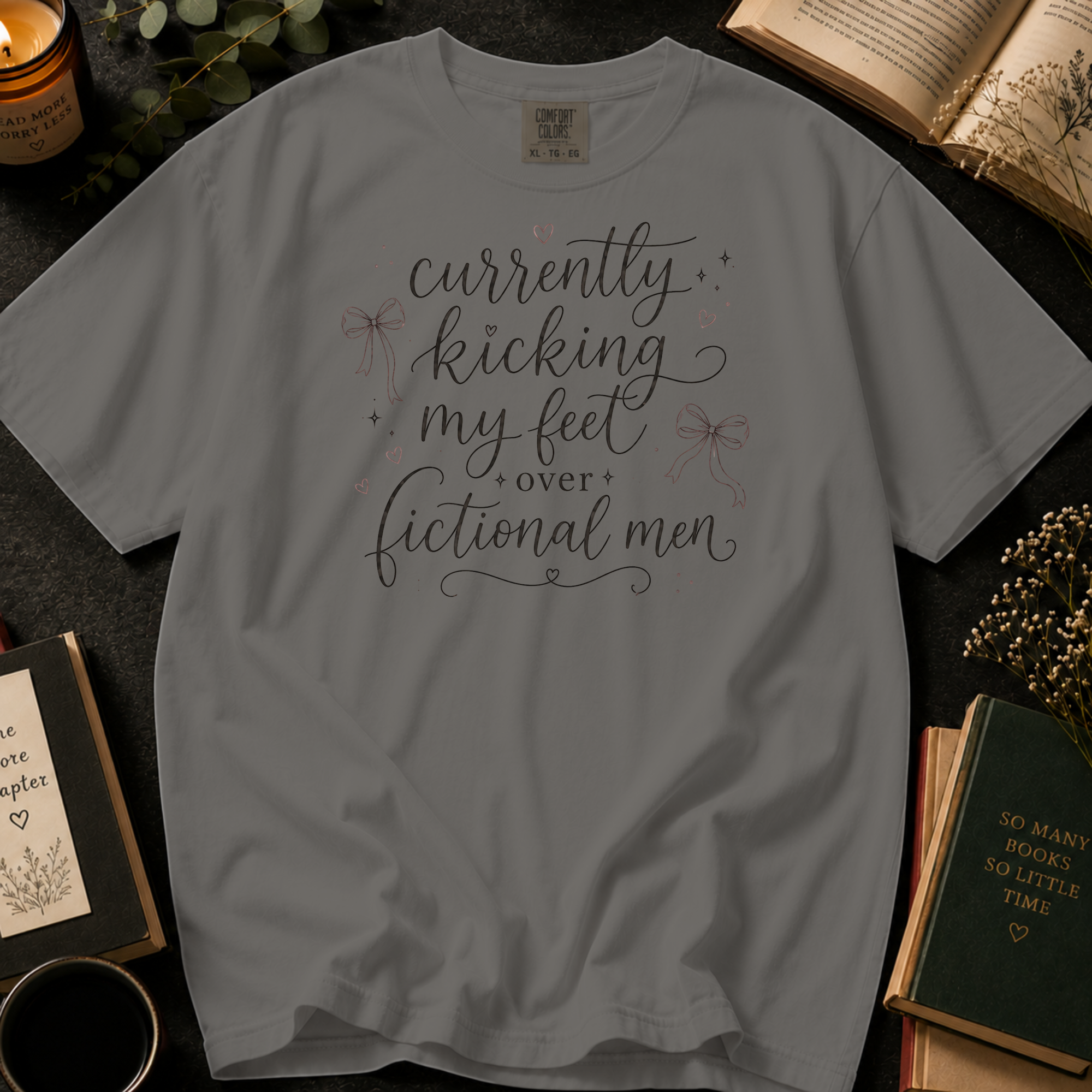Currently Kicking My Feet Over Fictional Men T-Shirt: Script and Bows in Grey - Comfort Colors® T-Shirt