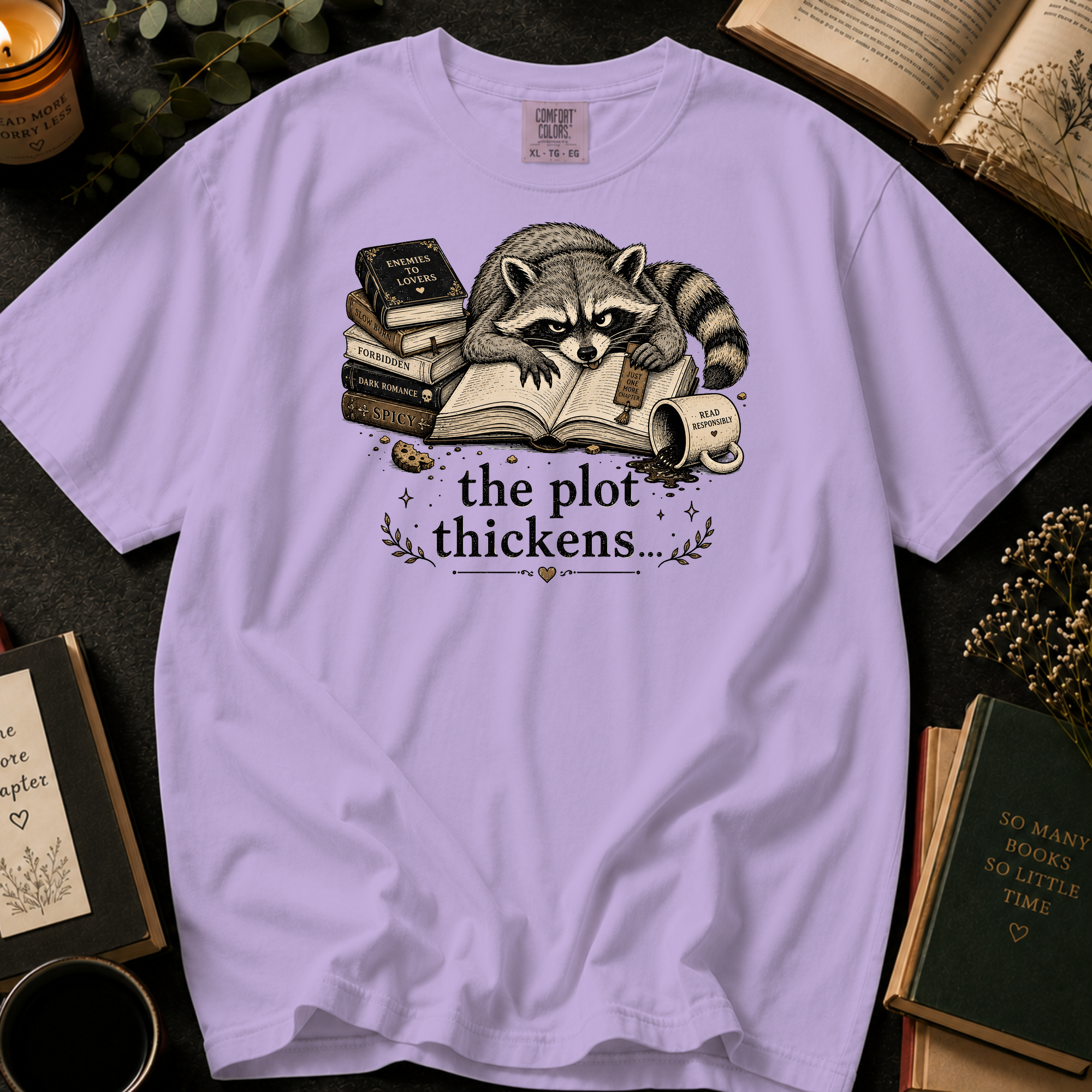 The Plot Thickens T-Shirt: Grumpy Raccoon Reading in Orchid - Comfort Colors® T-Shirt