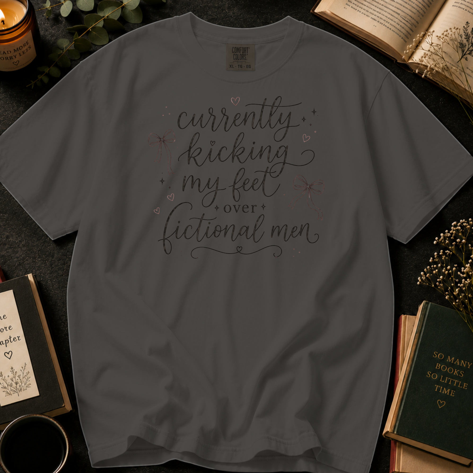 Currently Kicking My Feet Over Fictional Men T-Shirt: Script and Bows in Pepper - Comfort Colors® T-Shirt