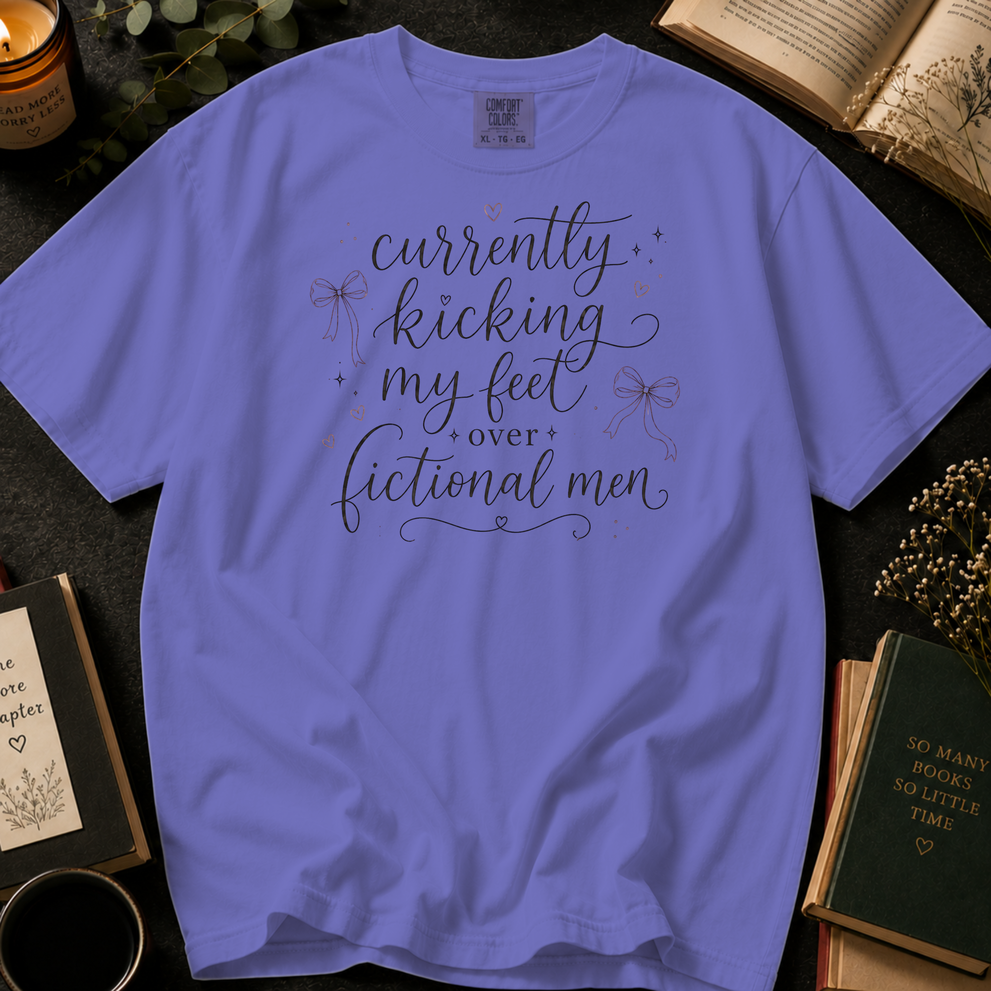 Currently Kicking My Feet Over Fictional Men T-Shirt: Script and Bows in Violet - Comfort Colors® T-Shirt