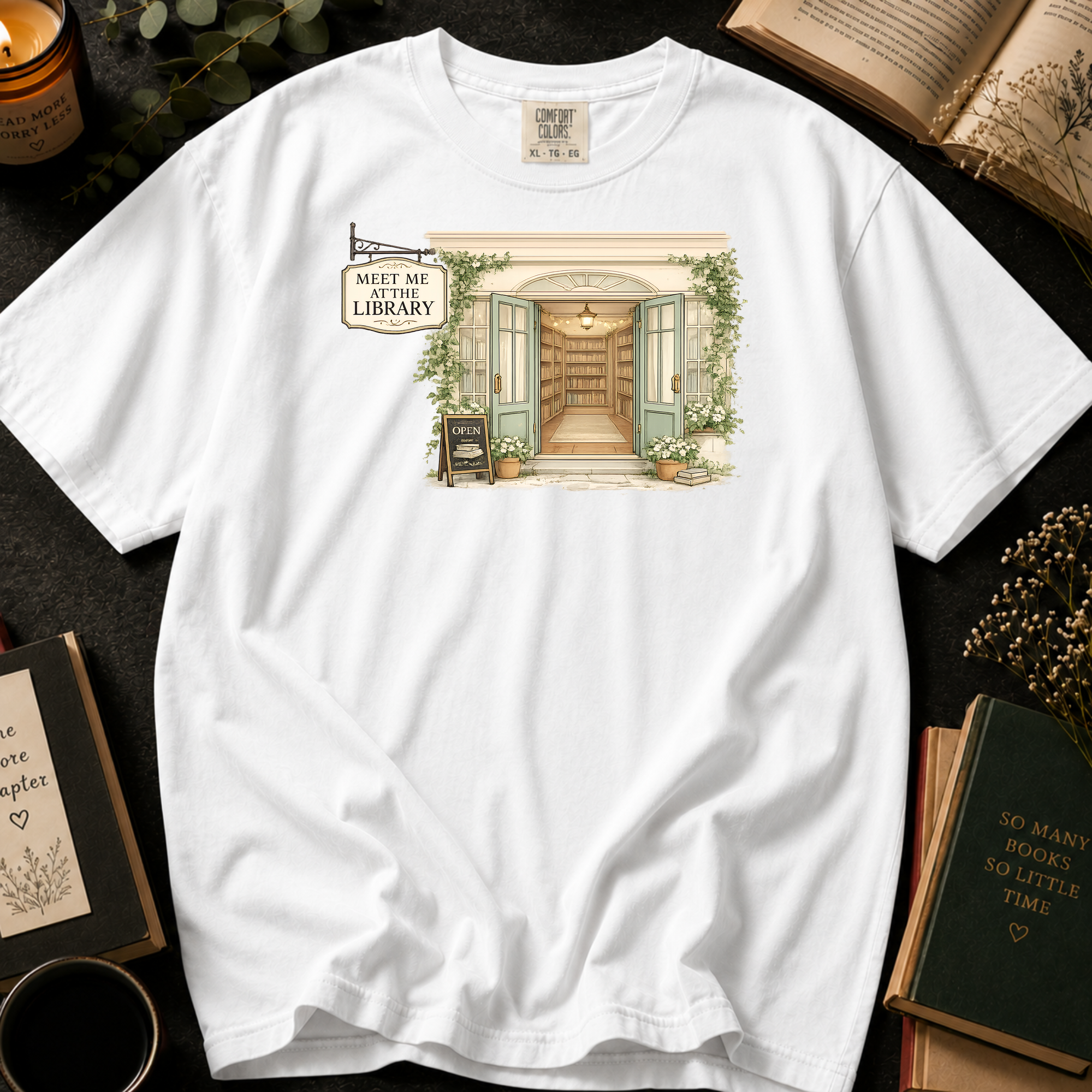 Meet Me At The Library T-Shirt: Cozy Bookshop Storefront in White - Comfort Colors® T-Shirt